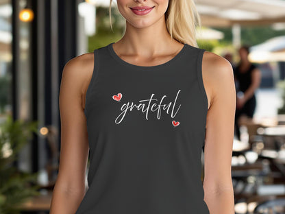 Charcoal Black Triblend Grateful Heart tank top with white cursive lettering framed by two red hearts diagonally positioned.