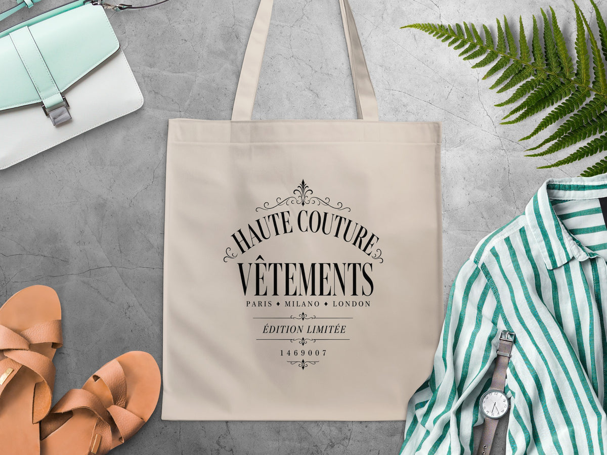 Haute Couture Vêtements canvas tote bag featuring Édition Limitée black lettering between fine ornamental rules.