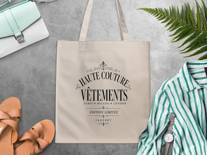 Haute Couture Vêtements canvas tote bag featuring Édition Limitée black lettering between fine ornamental rules.