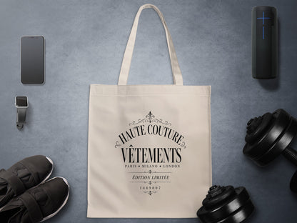 Vêtements tote bag displaying bold serif capitals above Paris, Milano and London black lettering in a vintage couture design.