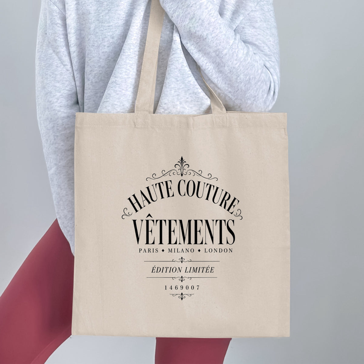 Natural canvas Haute Couture tote bag showcasing monochrome European fashion-house black lettering and elegant vintage ornamentation.