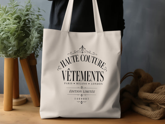 Haute Couture Vêtements canvas tote bag featuring ornate black fashion-house typography on natural canvas.
