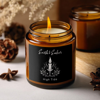 High Tide candle glowing softly, hand-poured coconut soy wax with a fresh coastal fragrance