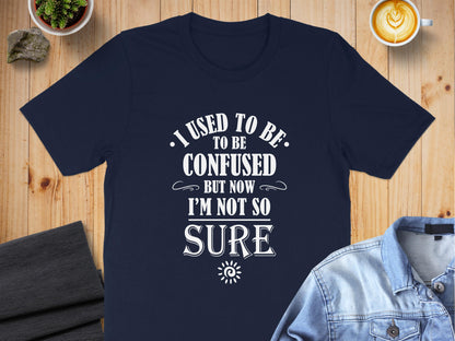 Navy I Used To Be Confused T-Shirt with vintage quote design, bold condensed lettering, and decorative editorial-style details.