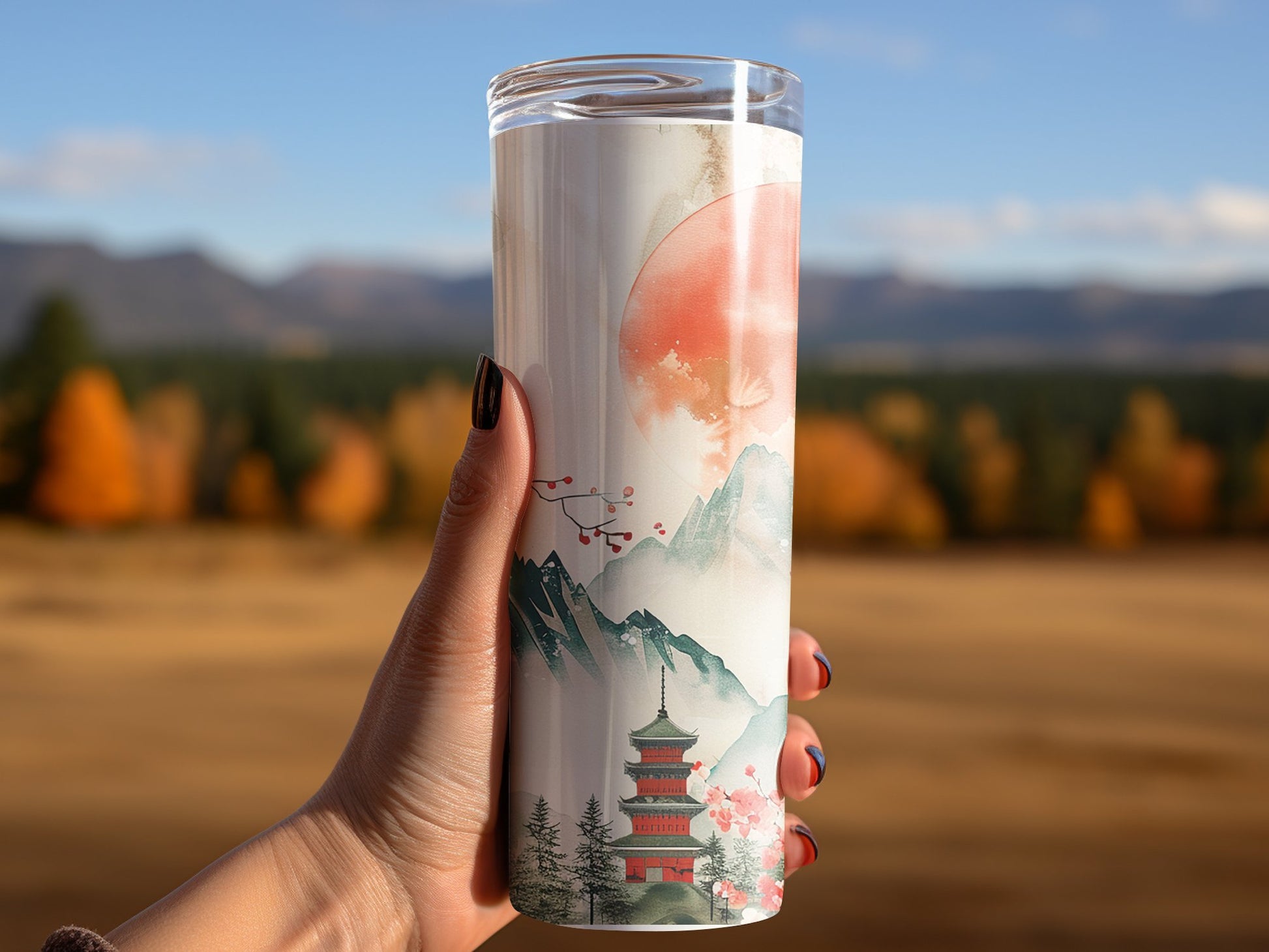 Woman using Japanese sunset tumbler, insulated 20oz tumbler with a peaceful sunset scene for a calming effect