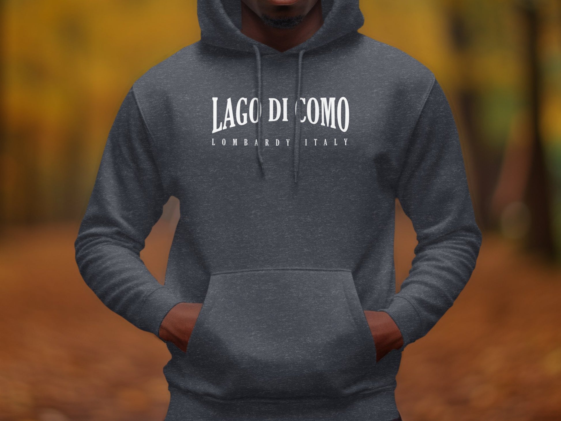 Dark heather grey Lago di Como Hoodie with minimalist serif typography and structured Lombardy Italy white subtitle.