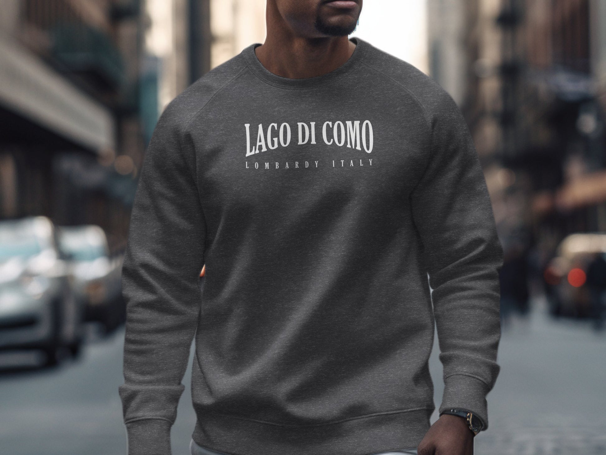 Dark heather Lago di Como Sweatshirt with minimalist arched Lago di Como white serif typography centre-chest design.