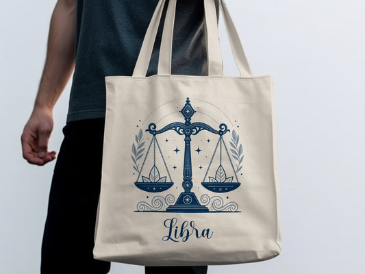 Libra tote bag featuring decorative scales motif with star patterning, elegant linework, and harmonious astrological design.