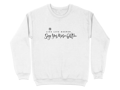 White Live Life Deeper sweatshirt displaying black centre chest quote with typographic hierarchy and small spiral sun icon.