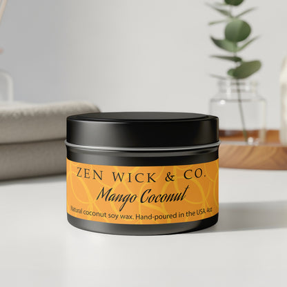 Mango coconut tin candle 4oz with lid on displayed on table highlighting compact size and clean design.