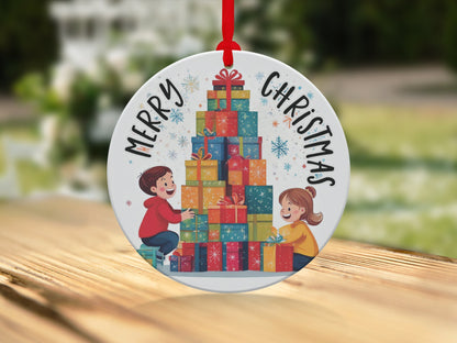 Festive ornament with illustrated boy and girl, towering gift boxes, and vibrant Christmas snowflakes.