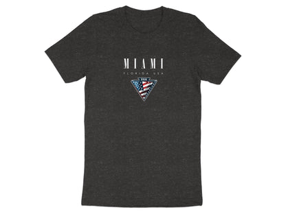 Dark heather grey Miami tee with centre-chest American flag emblem and metallic-style framed border.