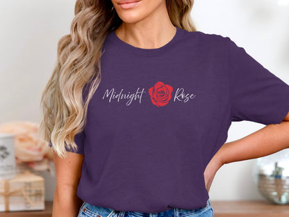 Purple Midnight Rose graphic T-Shirt with minimalist white script lettering and a red rose illustration between the two words.