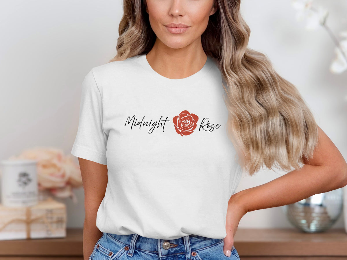 White Midnight Rose T-Shirt featuring a red rose in full bloom between the words in flowing black handwritten script across the chest.