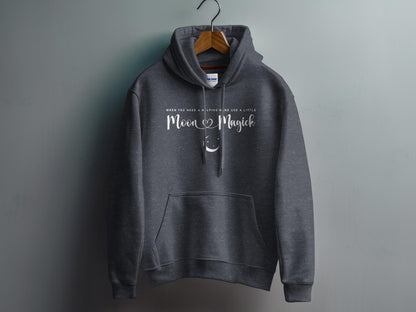 Dark Heather Grey Moon Magick Hoodie with elegant Moon Magick script lettering and small crescent moon illustration in a balanced chest design.