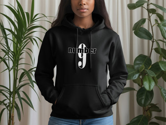 Black Number 9 hoodie with front pouch pocket, graphic print, ribbed cuffs, and drawstring hood.