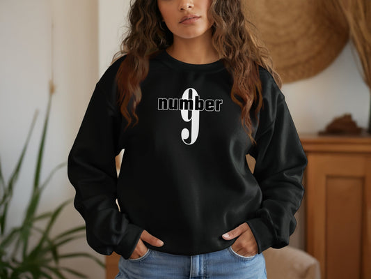 Black Number 9 sweatshirt with graphic print, long sleeves, and ribbed cuffs in cotton blend fabric.