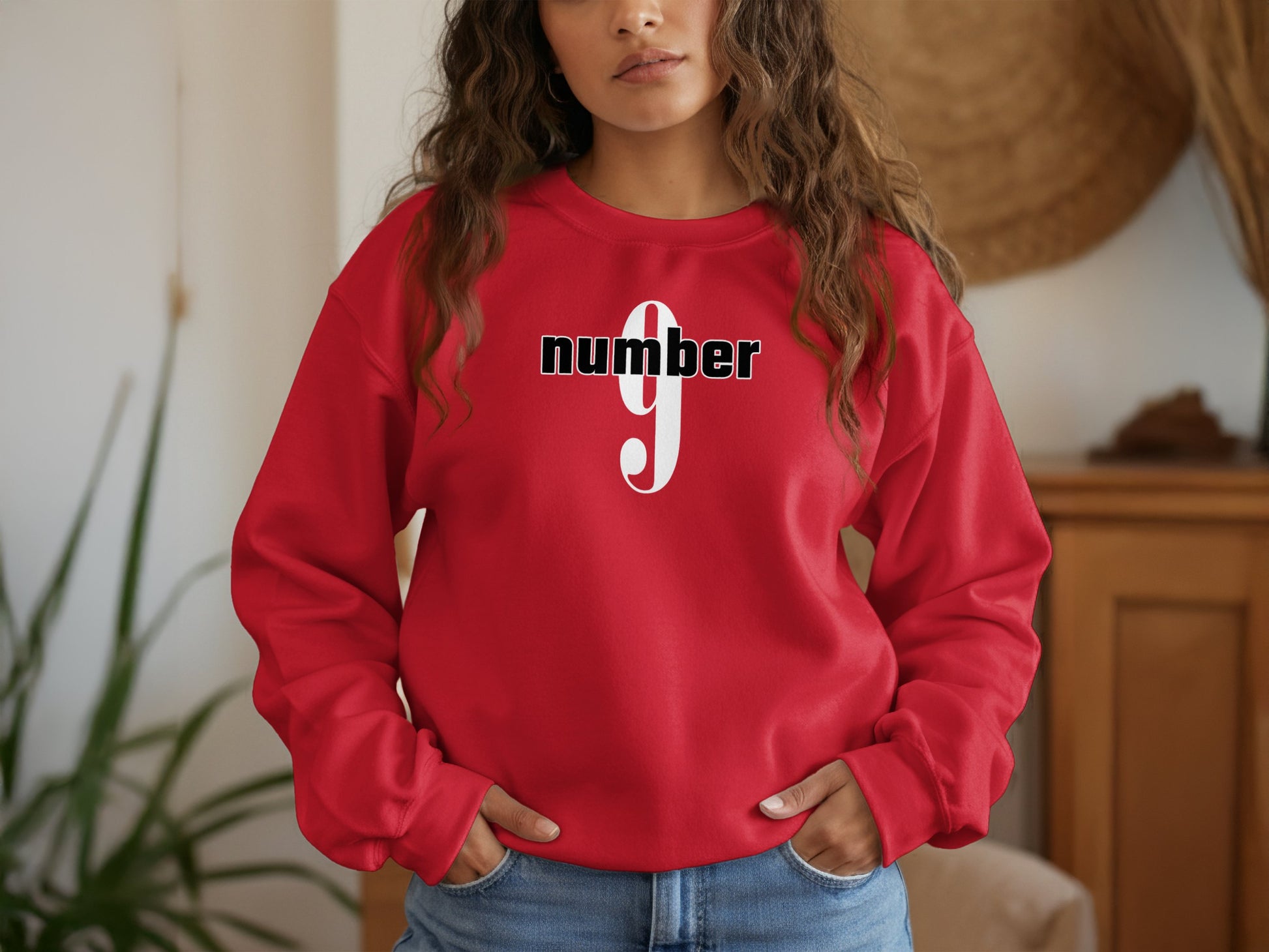 Red Number 9 graphic sweatshirt with ribbed cuffs, relaxed fit, and cotton blend comfort for daily wear.