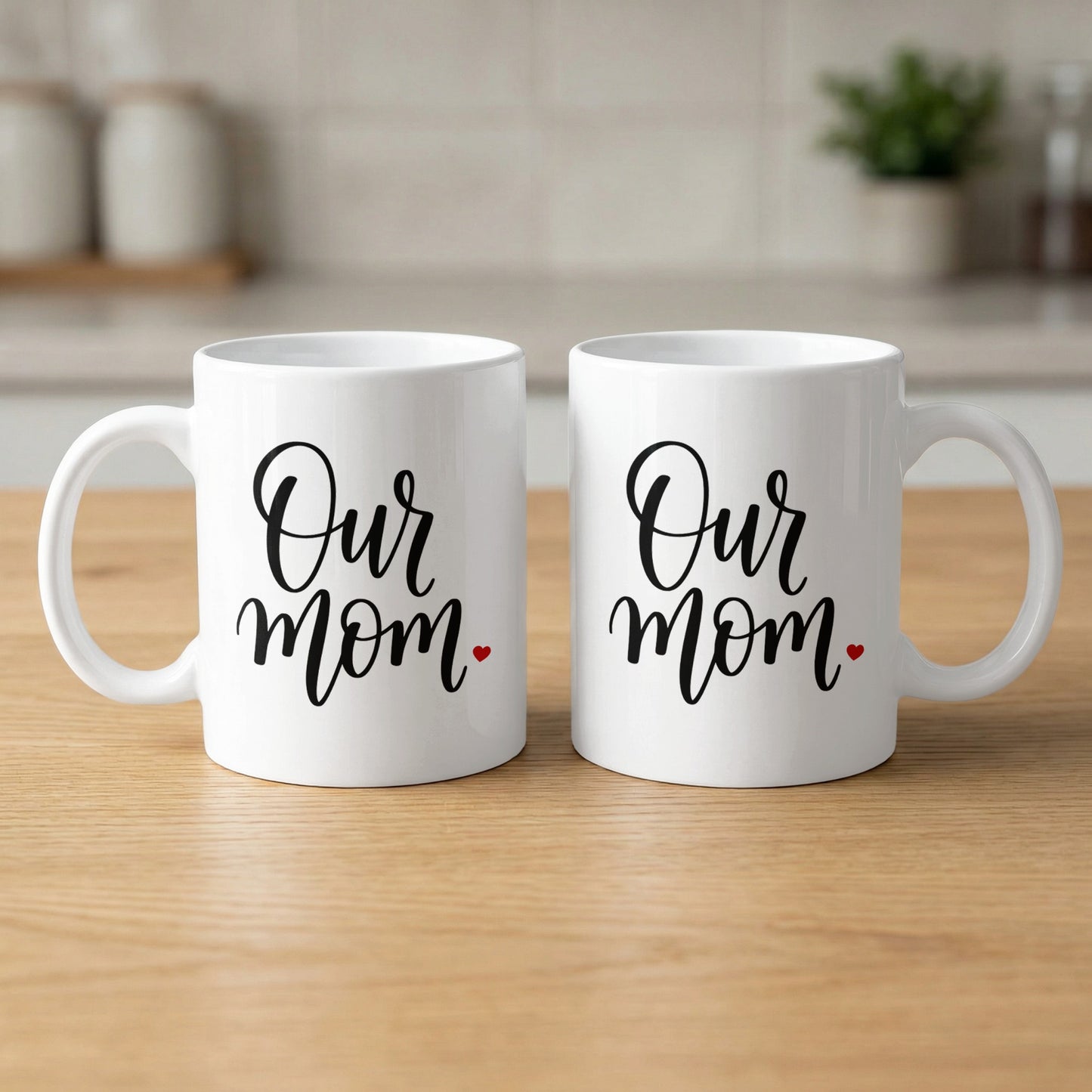 Two Our Mum Heart 11oz mugs showing elegant script design and red heart detail with glossy ceramic finish and print.