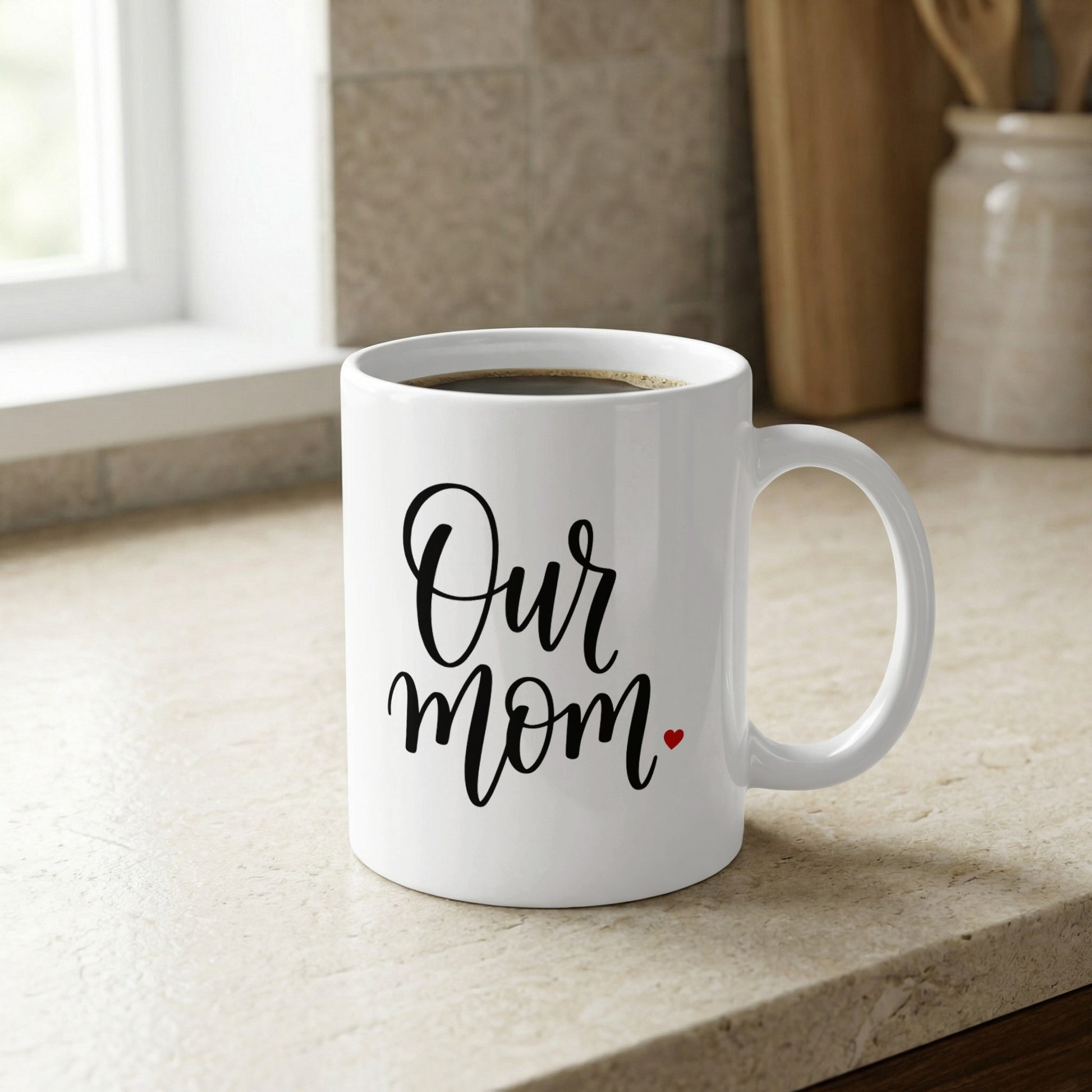 Our Mum Heart 11oz ceramic mug on kitchen counter, a heartfelt gift symbolizing family love and everyday appreciation.