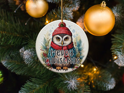 Ceramic Christmas ornament showcasing a festive owl portrait with winter greenery and seasonal details.
