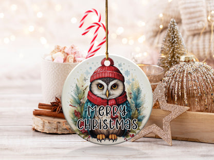 Owl Christmas ornament featuring a watercolour owl in a red pom-pom hat and knitted winter scarf.