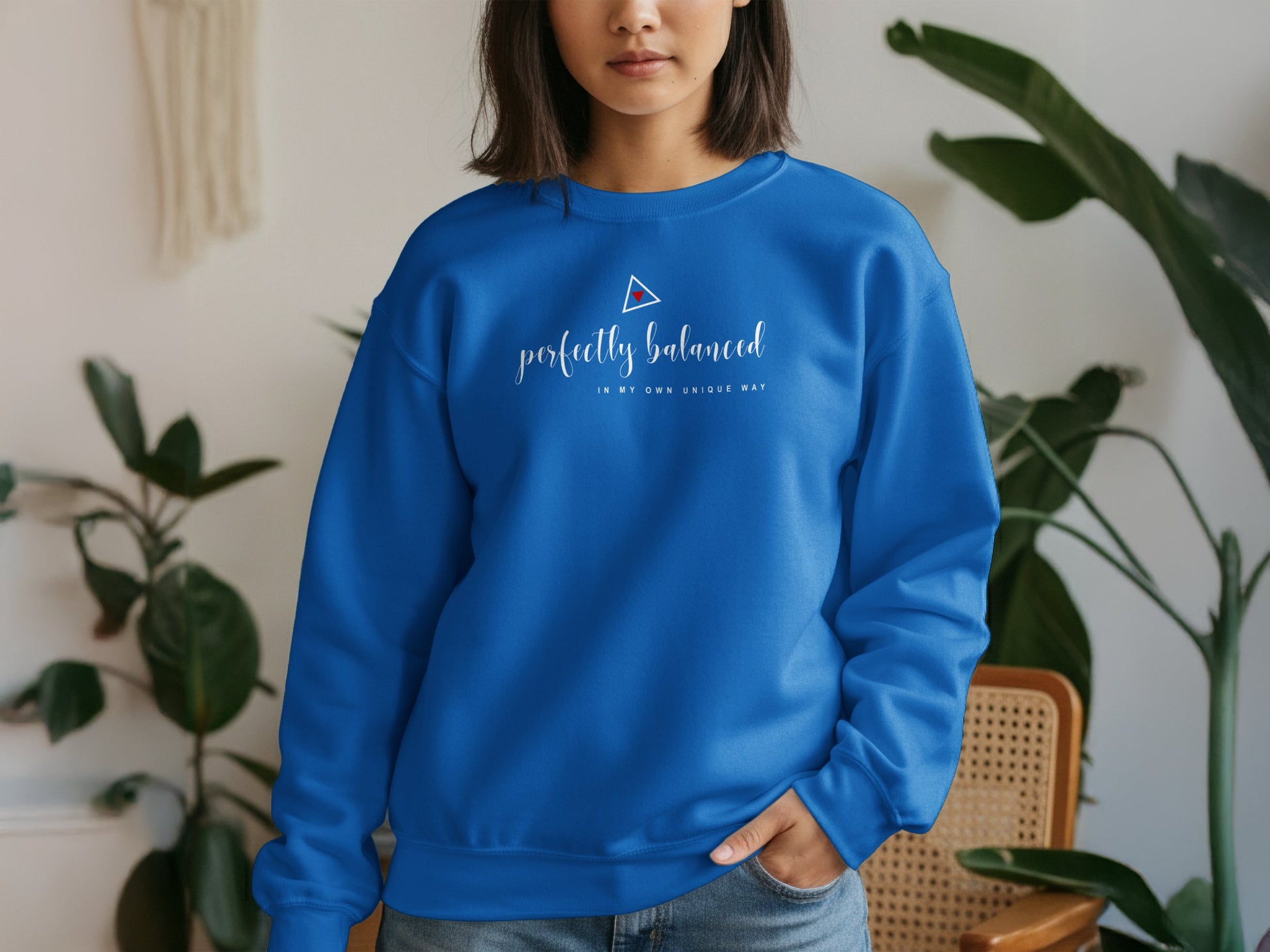 Blue graphic sweatshirt with positive balance-themed message, ribbed cuffs, relaxed pullover fit, and breathable fabric blend