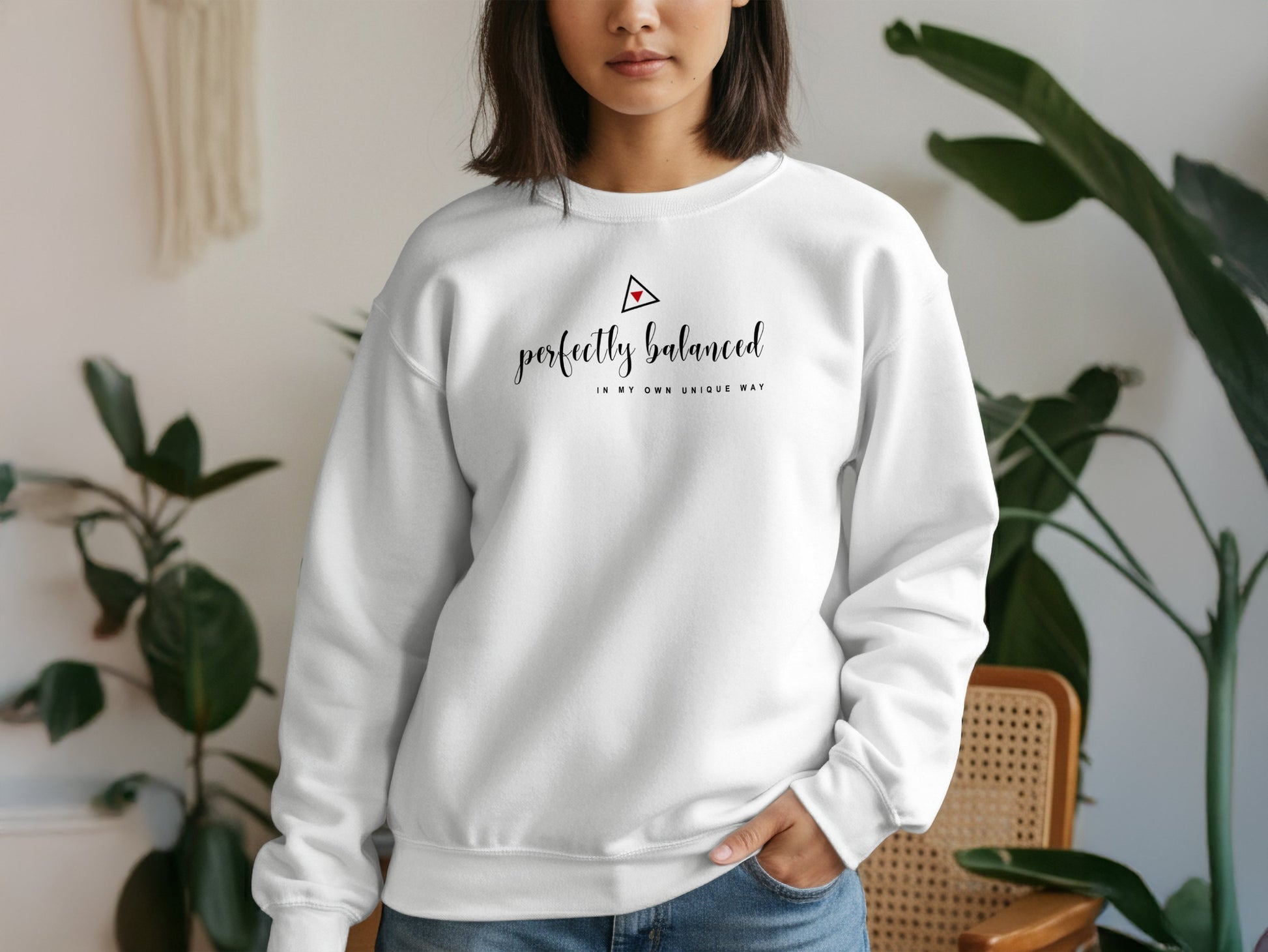 White pullover sweatshirt with bold perfectly balanced graphic, cotton blend, unisex sizing, and minimalist design appeal.