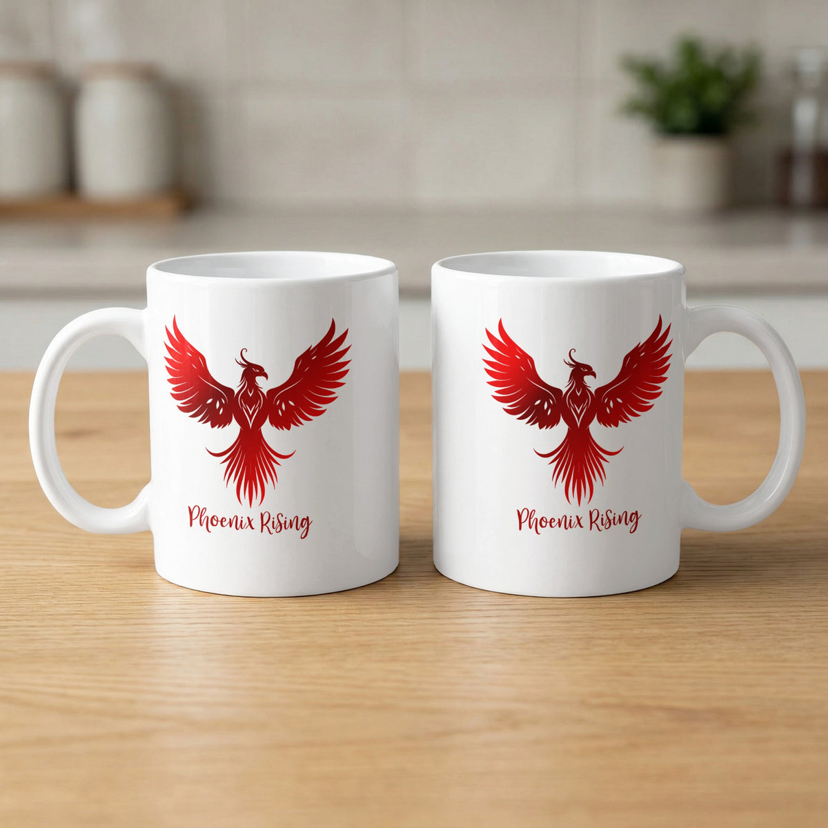 11oz white ceramic mug showing front and back with a red phoenix, curved tail feathers and Phoenix Rising red script lettering.