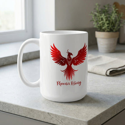 White 15oz ceramic mug on a kitchen bench featuring a red phoenix with wide-spread wings, raised head and detailed feather lines.