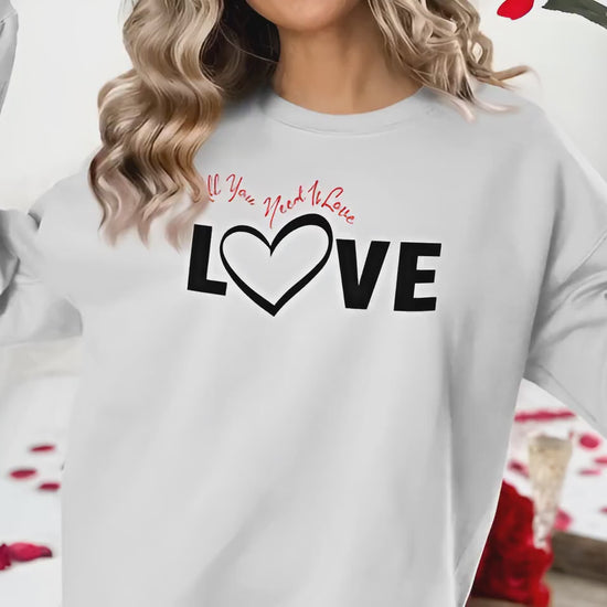 All You Need Is Love sweatshirt chest graphic with bold Love black typography and heart-shaped letter detail in centre.