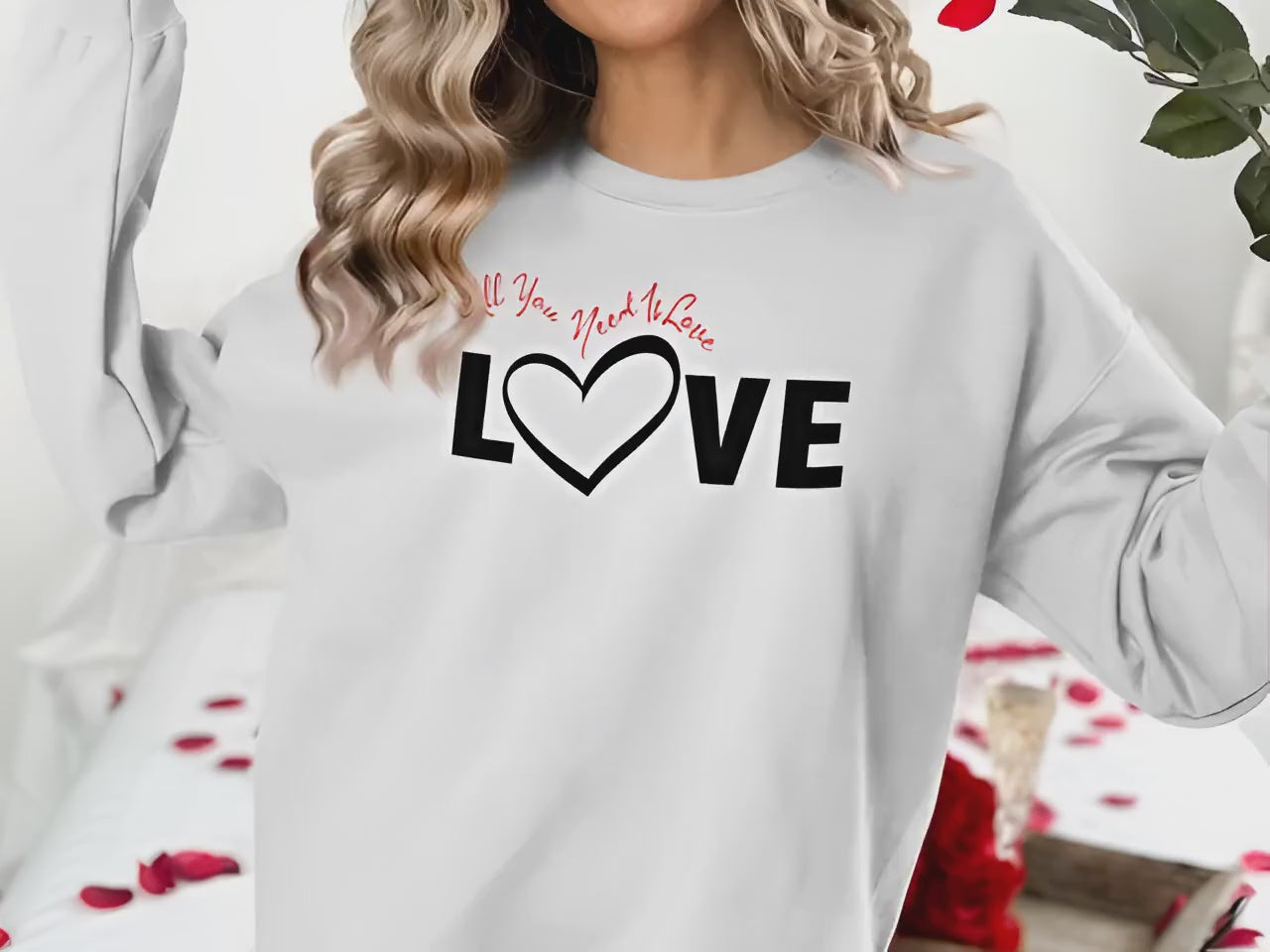 All You Need Is Love sweatshirt chest graphic with bold Love black typography and heart-shaped letter detail in centre.