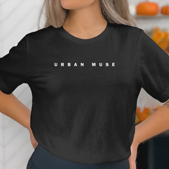 Video of short sleeve crew neck Urban Muse statement tee, offering unisex cut and soft cotton.