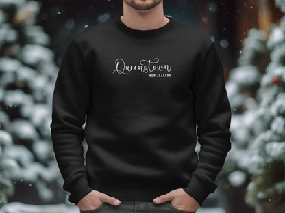 Black Queenstown New Zealand Sweatshirt, cotton blend, crew neck, seamless body, & relaxed unisex fit for cozy wear.