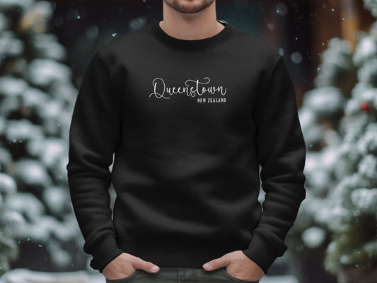 Black Queenstown New Zealand Sweatshirt, cotton blend, crew neck, seamless body, & relaxed unisex fit for cozy wear.