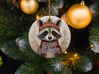 Festive raccoon Christmas decoration with signature mask markings, plaid headband, and boho woodland styling.