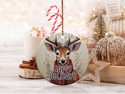 Happy Holidays round ornament featuring a woodland deer portrait framed by dried botanicals and berry branches.