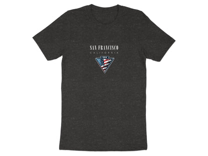 Dark heather grey San Francisco t‑shirt with centre‑chest USA badge, metallic triangle frame, and bold serif city lettering.