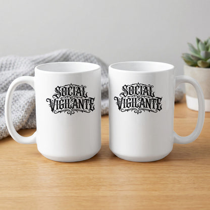 15oz Social Vigilante Mug showing both sides with matching ornate lettering, decorative motifs and bold monochrome artwork.
