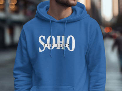 Royal Blue Soho New York Hoodie with graphic lettering, roomy pullover shape, and ribbed sleeve cuffs.