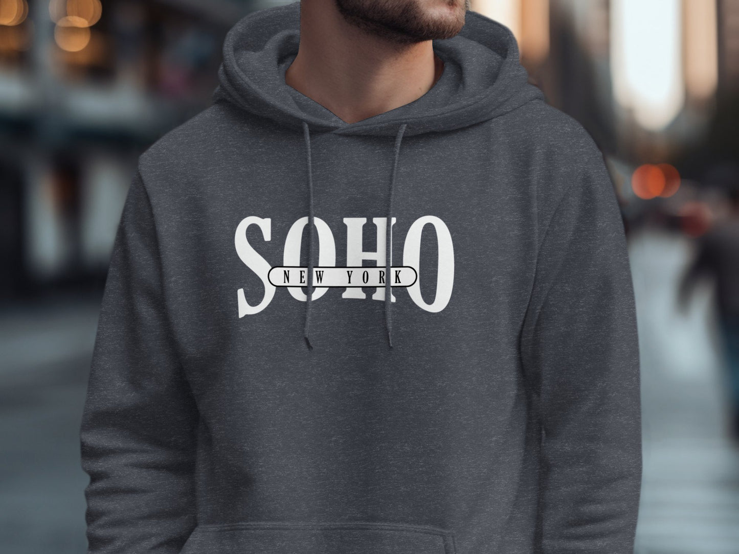 Dark heather grey Soho New York hoodie featuring editorial serif Soho typography and monochrome urban chest design.