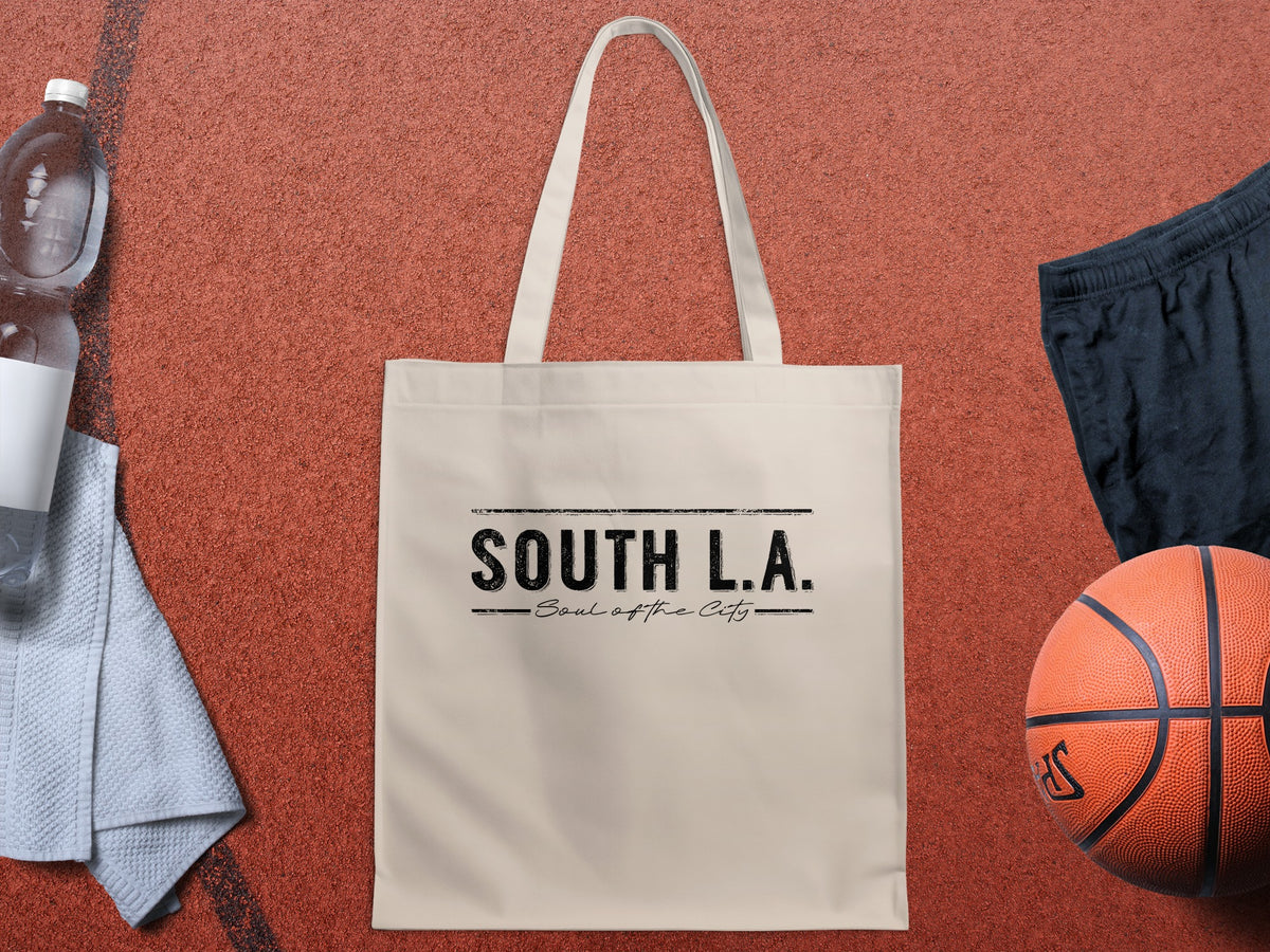 South L.A. Soul of the City canvas tote bag featuring distressed black lettering and handwritten script on natural fabric.
