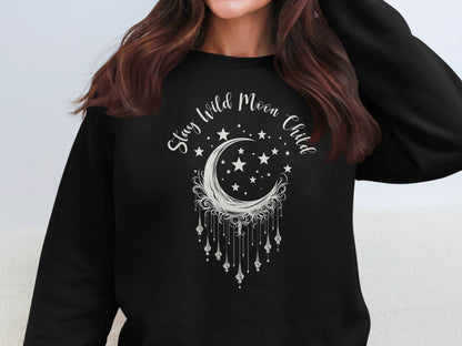 Stay Wild Moon Child black sweatshirt with celestial graphic, boho-inspired, soft cotton blend.