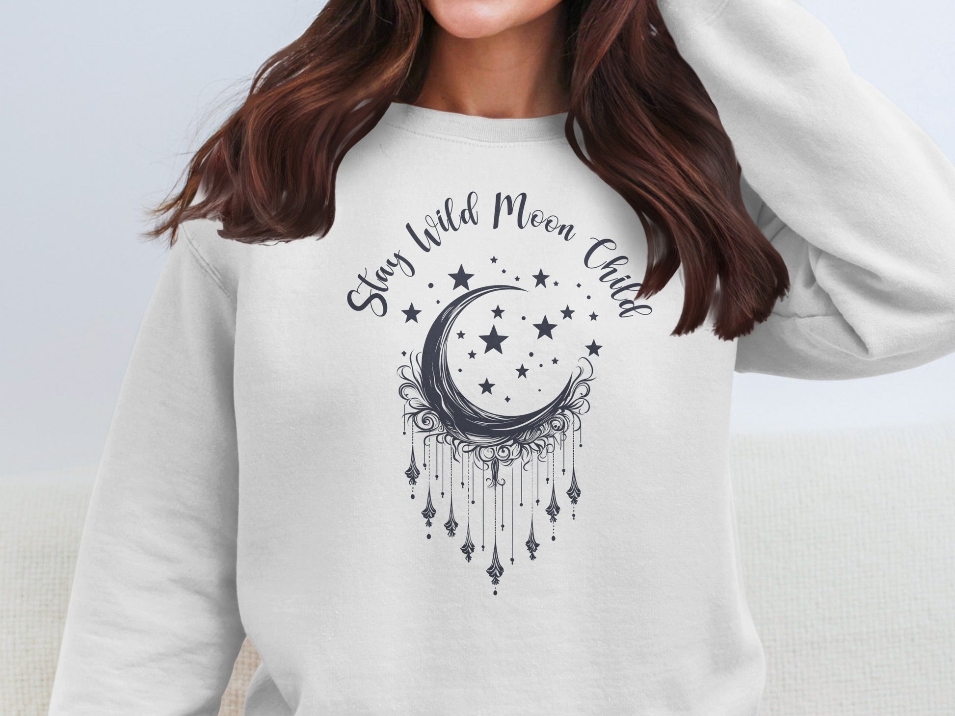 White Stay Wild Moon Child pullover with mystical moon print, warm and cozy, casual boho essential.