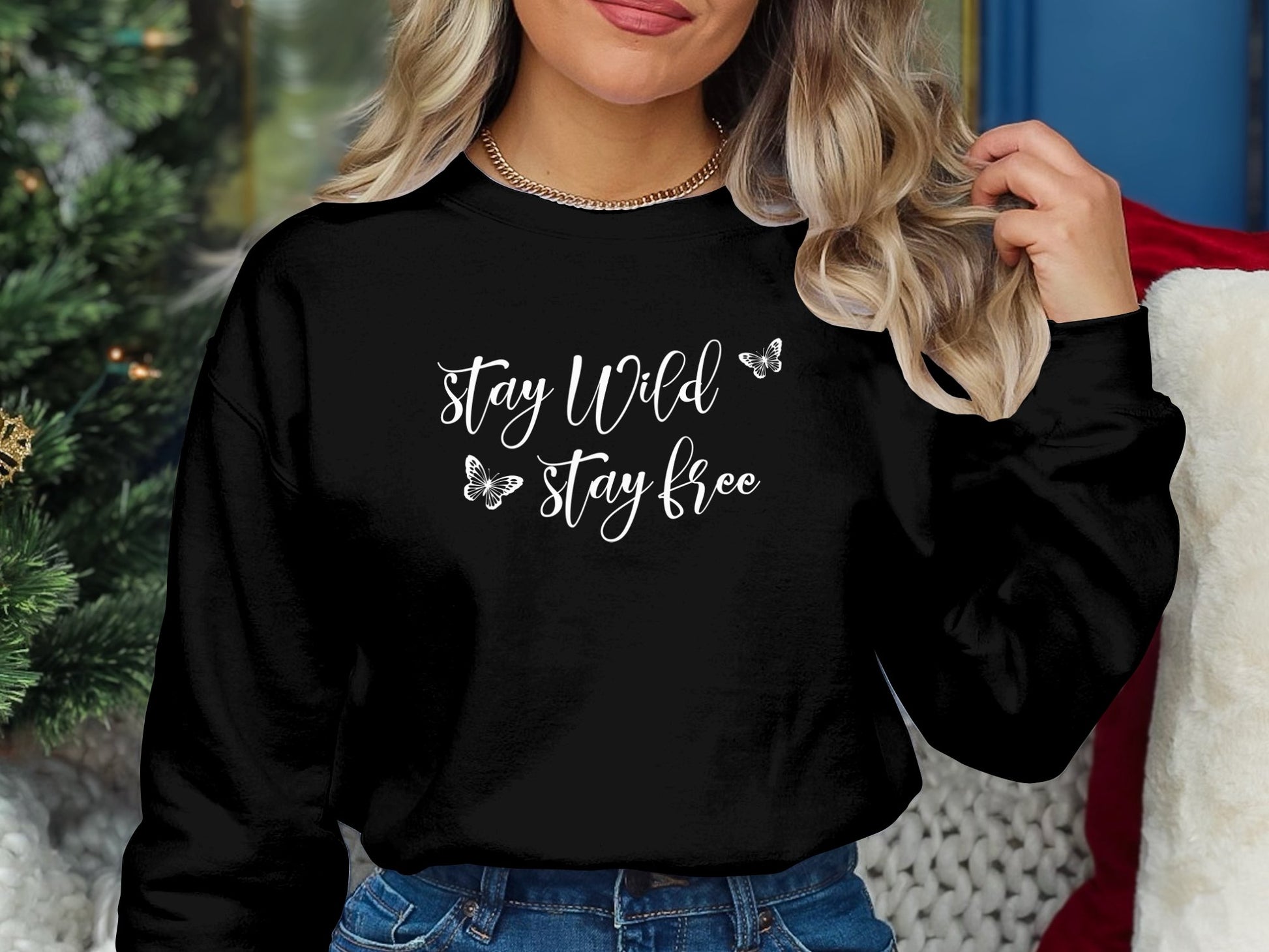 Stay Wild Stay Free pullover sweatshirt with bold graphic, unisex fit, crew neck, and seamless design for everyday comfort and style.