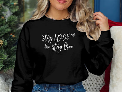 Stay Wild Stay Free pullover sweatshirt with bold graphic, unisex fit, crew neck, and seamless design for everyday comfort and style.
