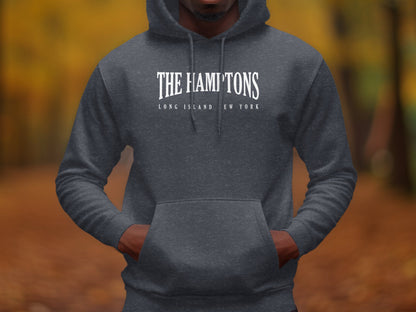 Dark heather grey Hamptons hoodie with refined white typographic chest print and minimalist coastal destination design.