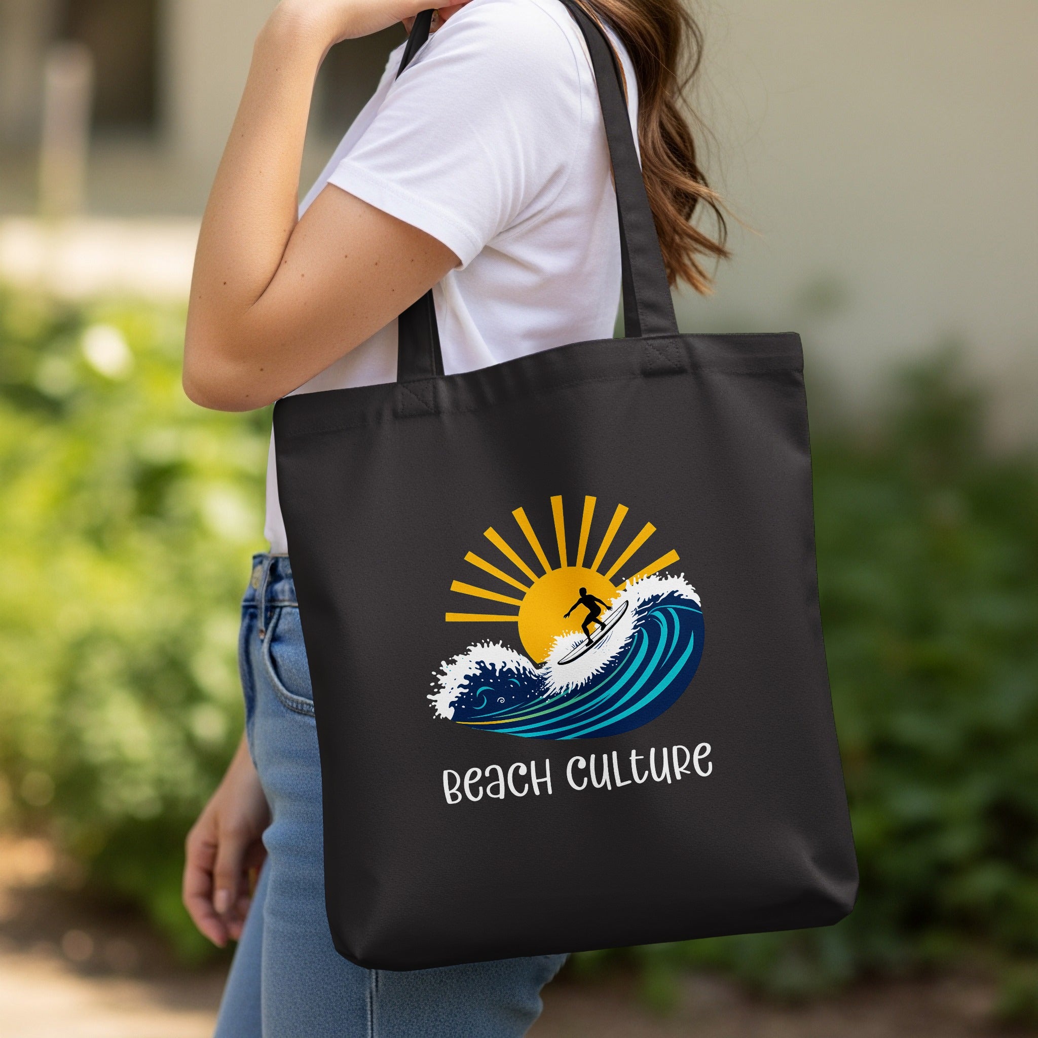 Woman carrying a printed tote bag over her shoulder in a casual outdoor setting.