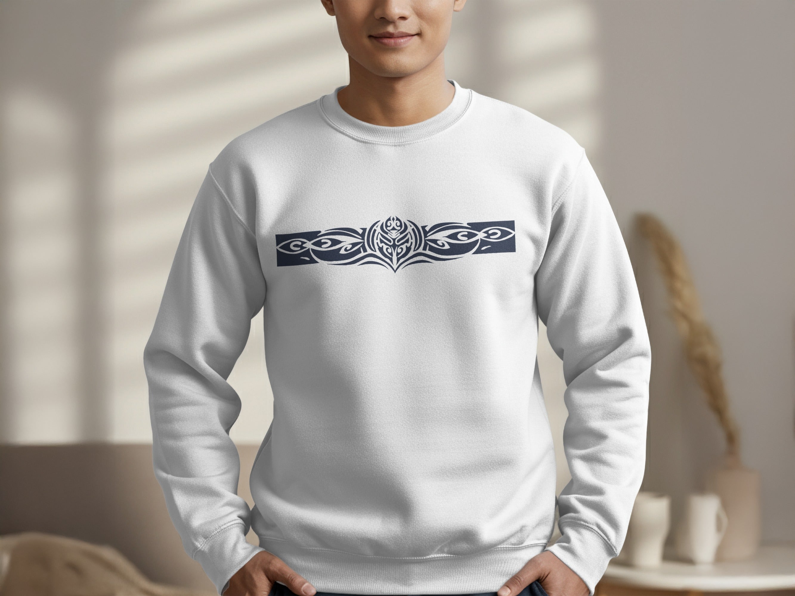 White Tribal Motif graphic sweatshirt featuring a dark grey central mask medallion with symmetrical tribal scrollwork design.