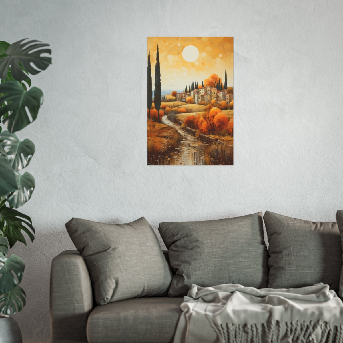 Tuscan River Village in Golden Light 20x30 poster shown above a couch highlighting warm golden tones.